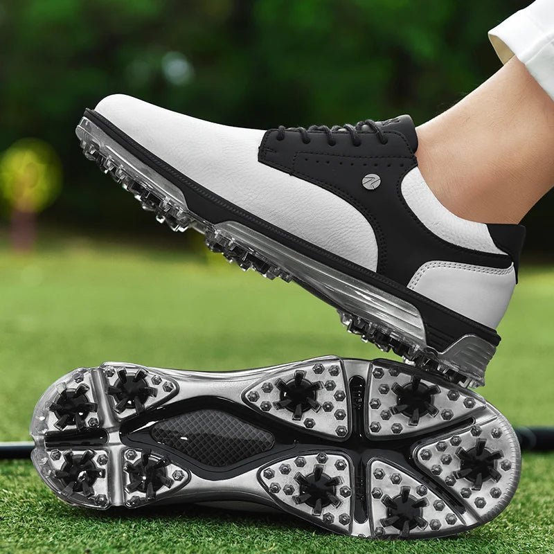 Golf Supplies & Equipment Golf Shoes Waterproof Non Slip Picture of the white black colour golf shoes on the grass of a golf course wear by a man with a golf club. Only see some part of his pant and shoes. Wear only one shoe that is put on top of the other shoe