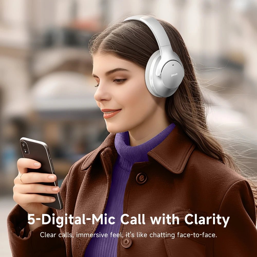 JEM Wellness Interior Noise Cancelling silver Colour Headphones Bluetooth 5.4 wear by a woman looking to cellphone picture