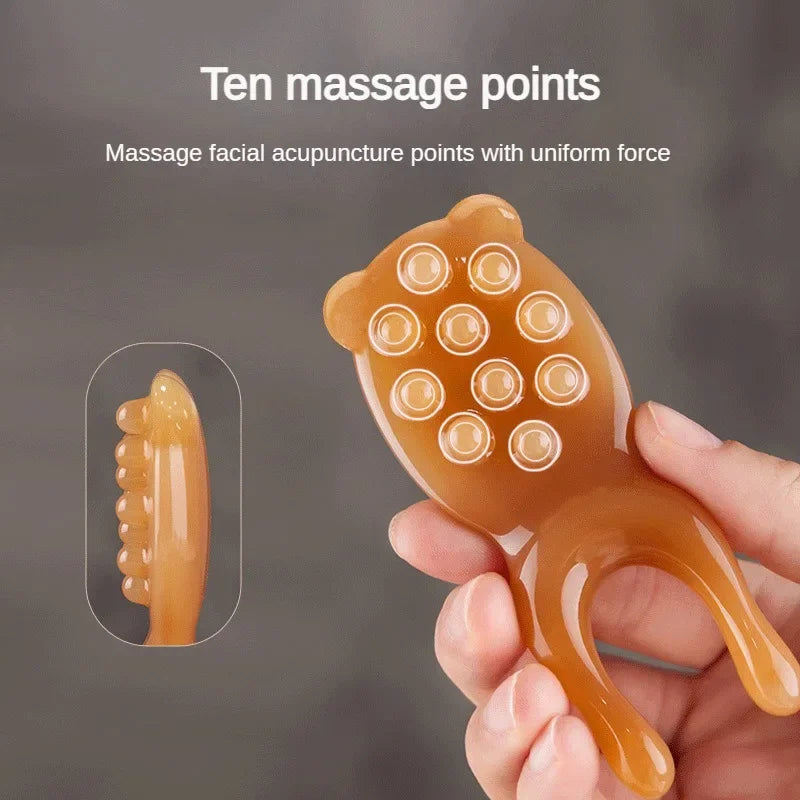 Massage Therapy Facial Massager Scraping Resin 1 ten massage points piece offers (goldfish nose litter) shown for facial massage   
acupuncture