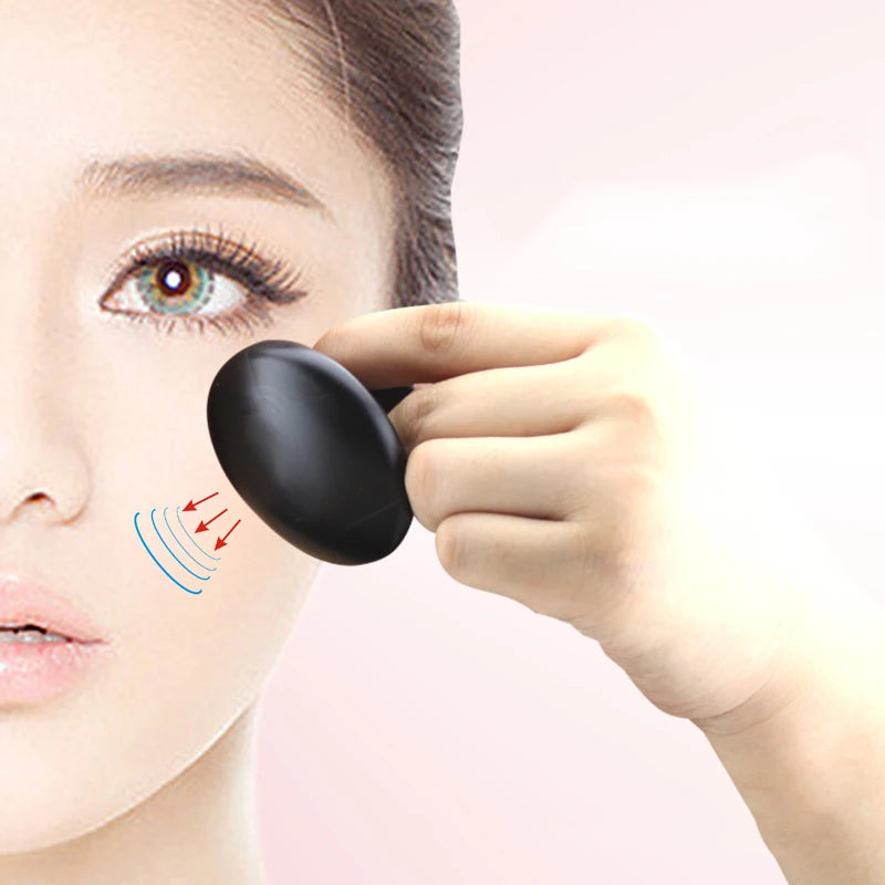 Massage Therapy Handmade Black Basalt Mushroom Stone Massager Picture of a lady use the product on her face