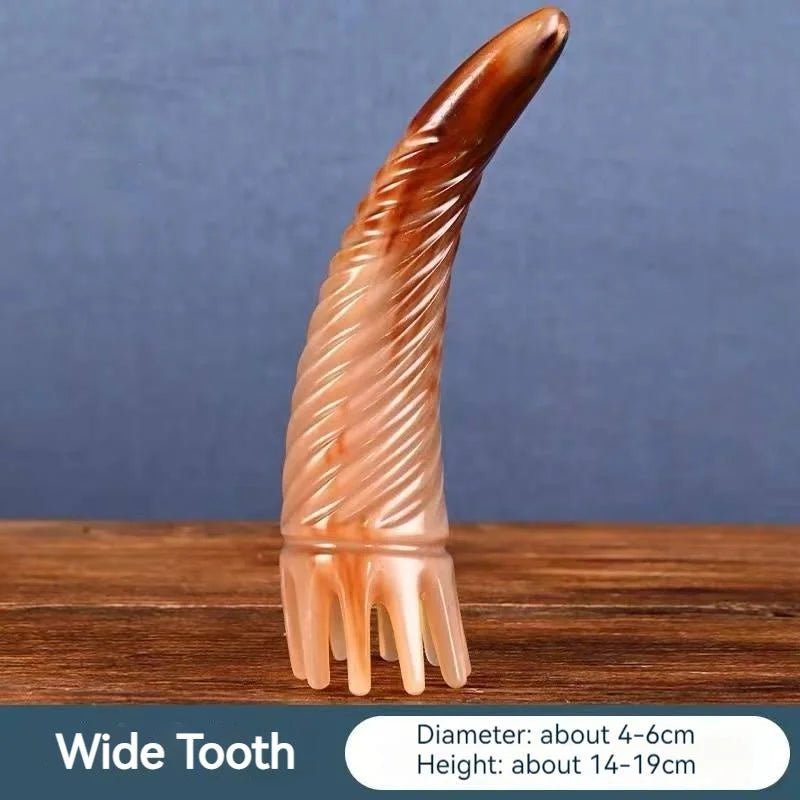 Massage Therapy Handmade Natural Yak Horn Massage Long Comb with long tooth shown Tooth down on a wood table