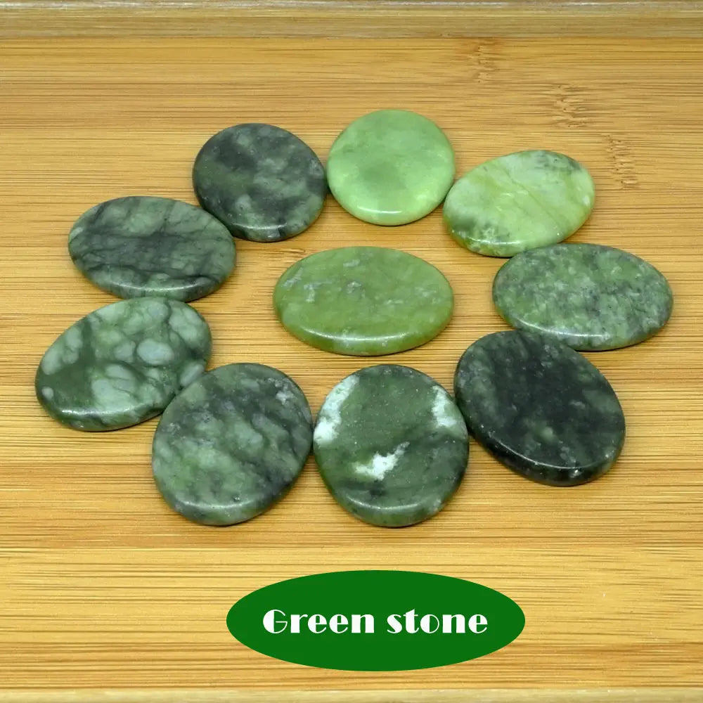 Massage therapy Jade Quarts Natural Stone set (10 Pieces 3 x 4 cm)  picture of 10 light green stones offers with a table of wood in background
