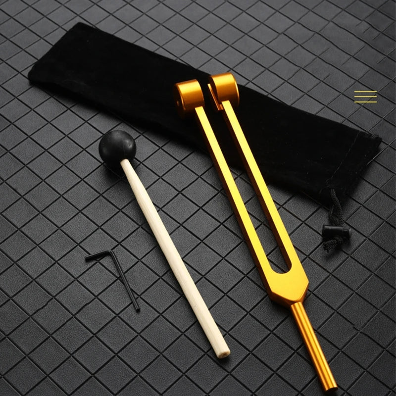 Medical Supplies & Equipment 64 Hz Forks for Healing Sound Therapy 1
percussion stick and 1 gold colourful Fork shown with the black storage bag