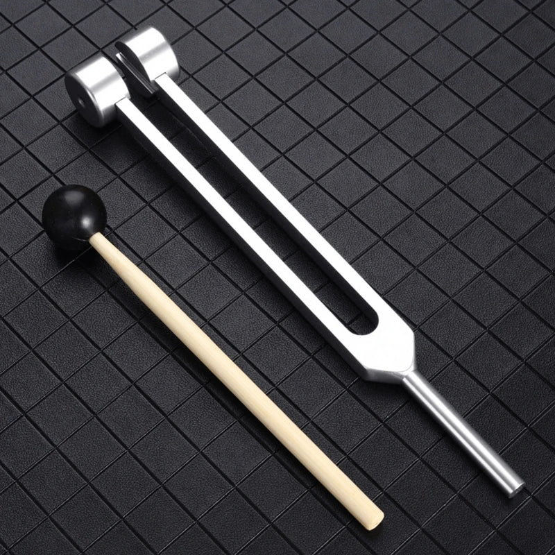 Medical Supplies & Equipment 64 Hz Forks for Healing Sound Therapy 1
percussion stick and 1 silver colour fork shown with nice background