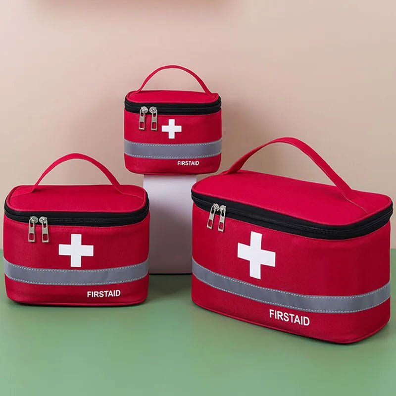 Medical Supplies Equipment First Aid 3 Kit Medicine Storage red Bag all with the white cross in front and First Aid name on it picture with a green background