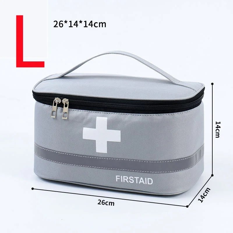 Medical Supplies Equipment One First Aid Medicine Storage gray bag with the white cross in front and First Aid name on it. The picture show a large size (26 cm X 14 cm X 14 cm) gray storage bag.