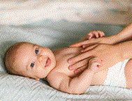 Baby Health Care Picture Picture of a mother massaging the chest of her baby son who is laughing and full of joy
