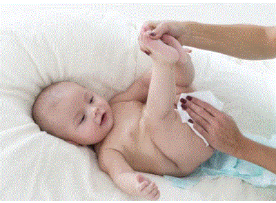 Baby Health Care picture of a baby's bottom being cleaned during a diaper change