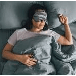 Personal Health Care Woman sleeping deep with her eye mask on her bed