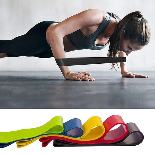 Fitness Yoga CrossFit Resistance Bands, all colour offers shown (Green, blue, yellow, red and black) Woman exercise with black band to make push up