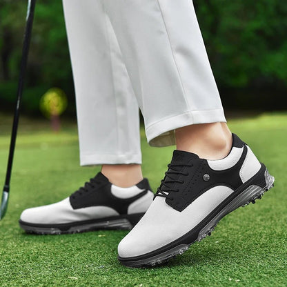 Golf Supplies & Equipment Golf Shoes Waterproof Non Slip Picture of the white black colour golf shoes on the grass of a golf course wear by a man with a golf club. Only see his pant and shoes.
