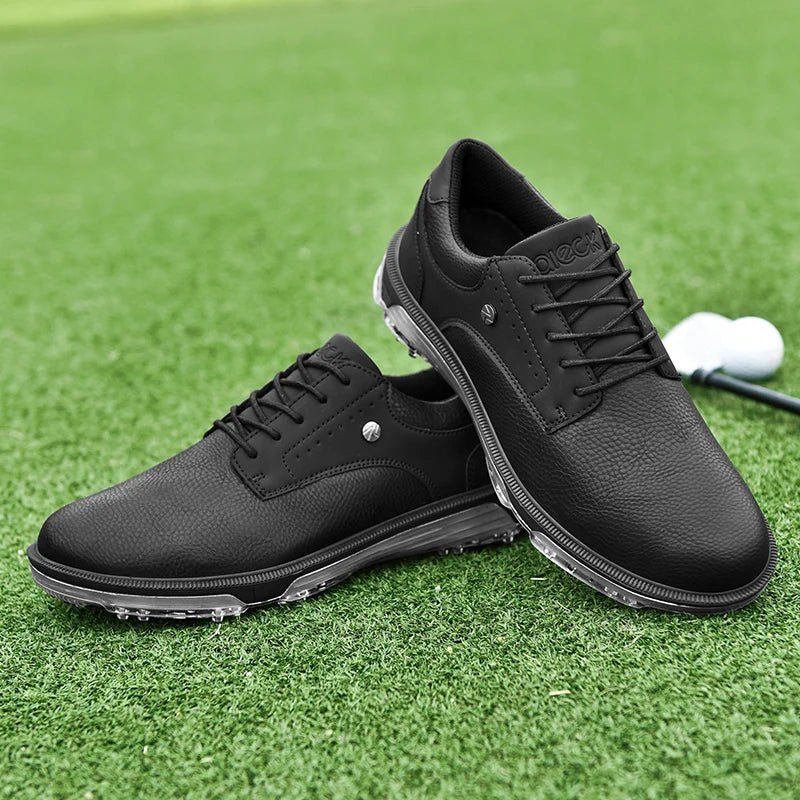 Golf Supplies & Equipment Golf Shoes Waterproof Non Slip Picture of Two Black Colour shoes balanced one on top of the other, placed on a closely mown lawn of a golf course with a club and ball in the back of the shoes