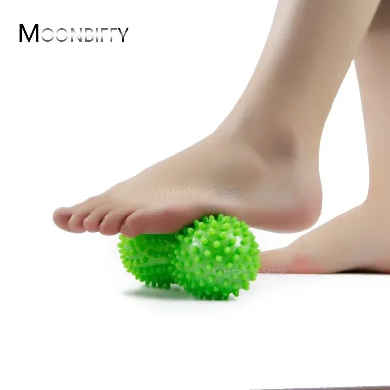 Double Peanut Foot Massage Roller Ball Green COlour being roll under a man foot