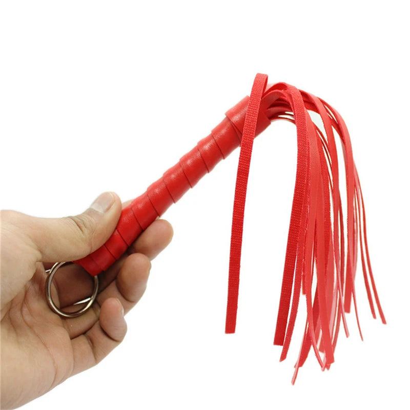 Massage Therapy Leather Whip Red Colour, length 28 cm Offers Picture of the red whip held by a man left hand