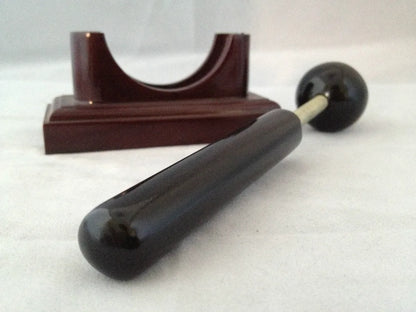 Massage therapy Sphere Black Jade Stone Hammer Tool in front of its base