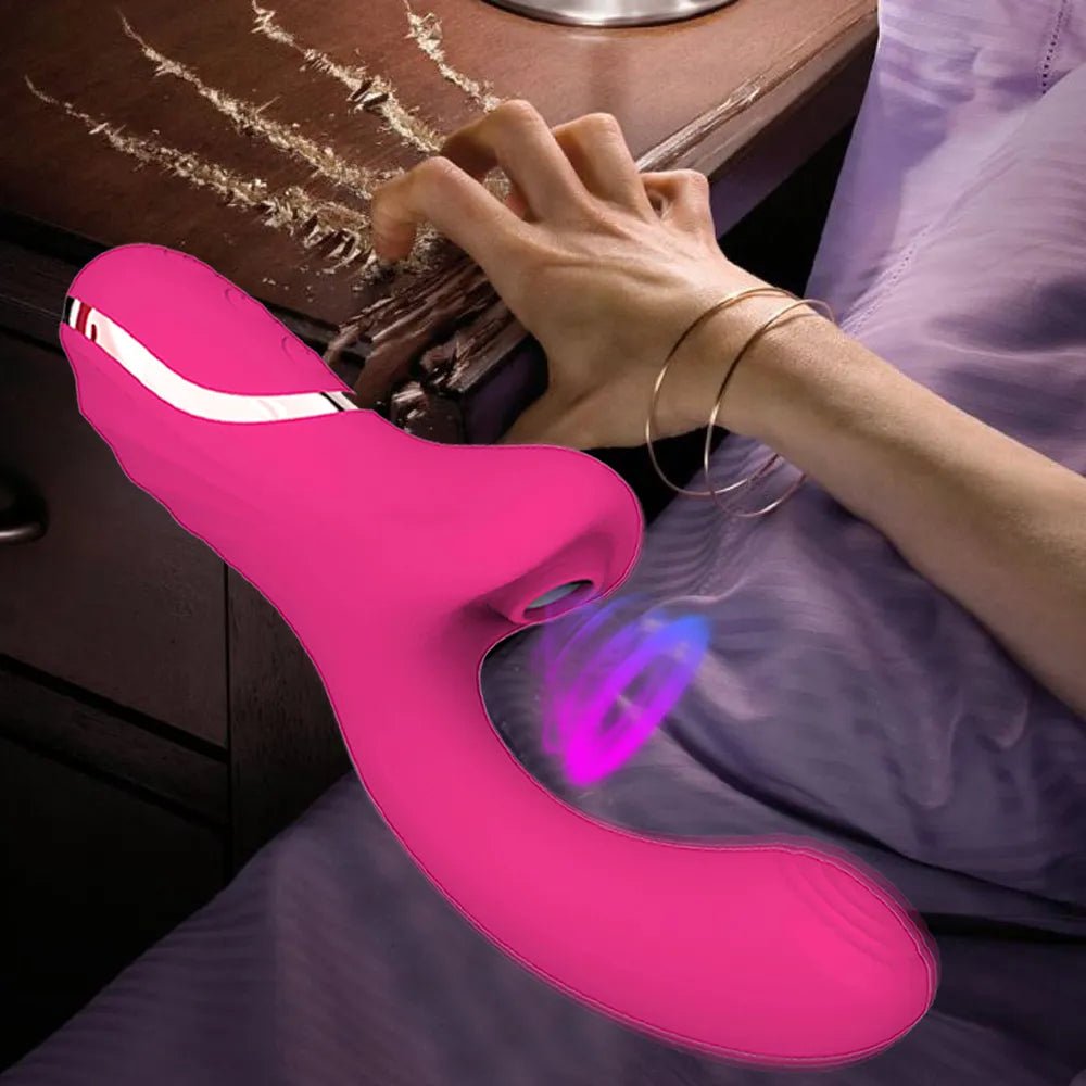 Wellness Clitoral Vibrator picture show a woman's hand scratching the top of a bedroom desk with her nails the Pink colour vibrator, NO storage box offers