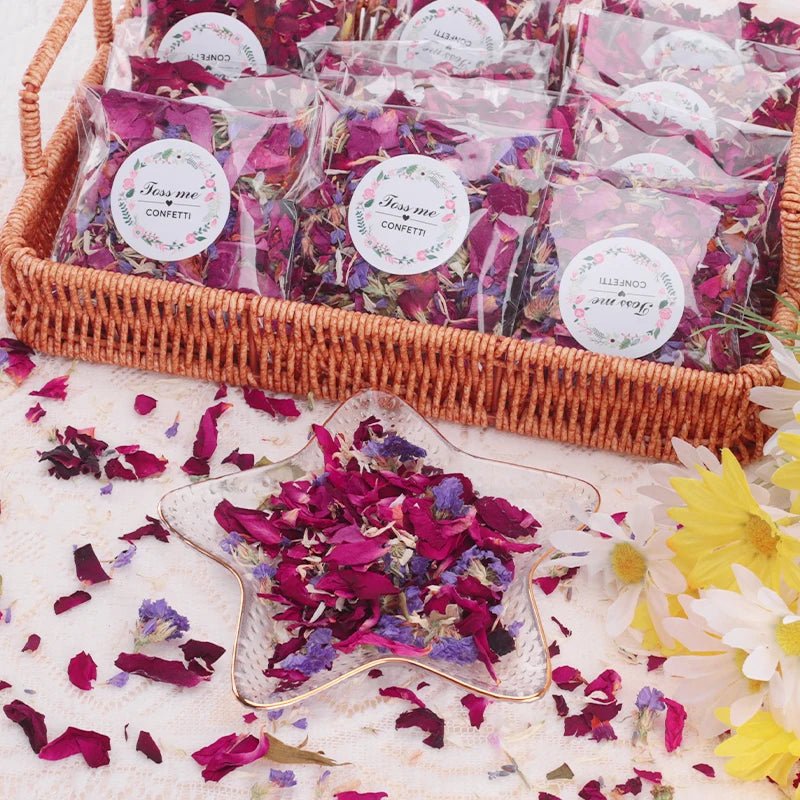 Wellness Dried Flower 100% Natural Petal Biodegradable Rose 100/200 g offers. Picture show a wicker basket filled with 10 small bags of flower petals to be given to wedding guests to throw at the bride and groom and the 100 gr bag offers