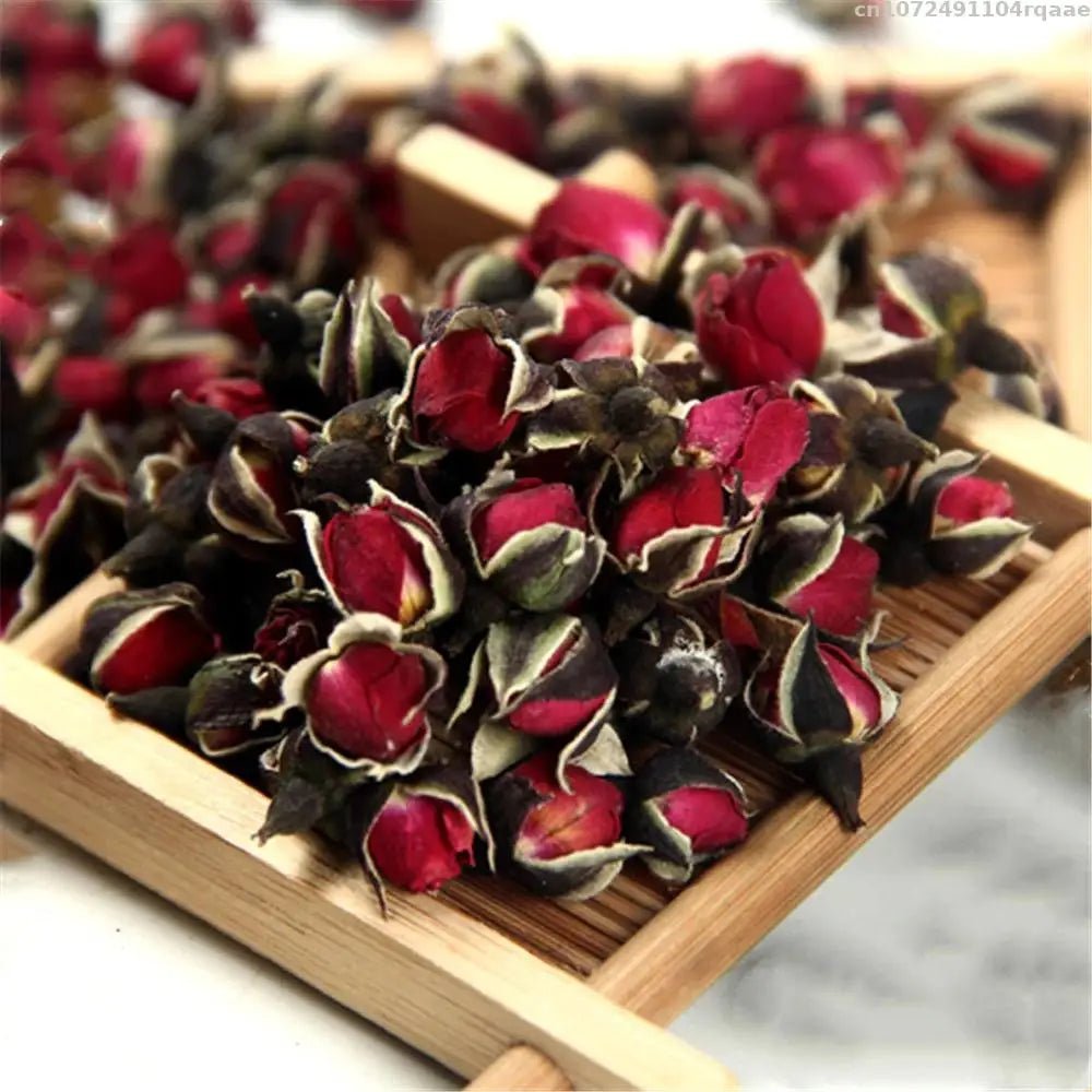 Wellness Natural Dried Rose Red Flower buds Place on a tray in a wooden frame with a base made of small bamboo reeds.