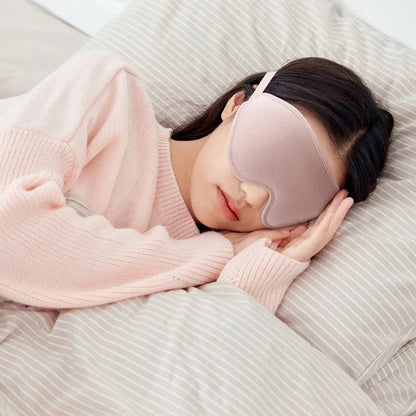 Jem Wellness Collection Soft 3D Sleep Mask for Light Blocking and Comfortable Rest Pink Colour Offers shown Used by a woman sleeping lying on her bed